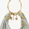 Kleine Hobo-Tasche mit Armband aus genarbtem Leder