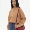Kleine Hobo-Tasche mit Armband aus genarbtem Leder