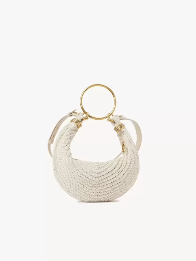 Kleine Hobo-Tasche mit Armband aus Häkelarbeit